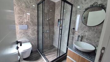 Shower, hair dryer, slippers, towels
