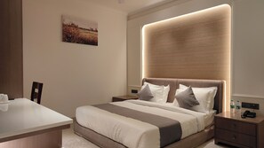 Habitación individual ejecutiva | Escritorio, espacio para trabajar con laptop y cortinas blackout