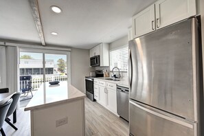 Coffee/tea maker, fridge, microwave, oven - Newly Renovated 4-Bedroom, 1.5-Bathroom Canal-Front Home in South Bethany Beach; Parking Pass, Free WIFI and 2 Large Decks! (Bethany Beach)