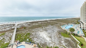 A resort with a beach, a pool, and a view of the ocean. - Phoenix VIII by Brett Robins Vacations (Orange Beach)