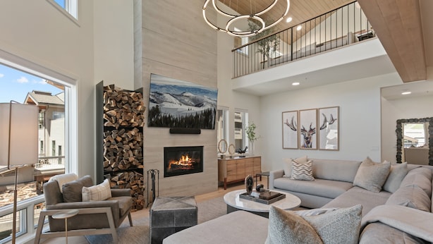 A spacious living room with a fireplace, a high ceiling, and a balcony. - Steps From Ski Lift Hot Tub & Fireplace 3 Bedroom Condo (Park City)