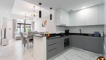 Family Villa, Garden View | Private kitchen | Electric kettle, toaster, freezer, dining tables
