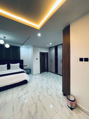 Desk, laptop workspace, blackout curtains, iron/ironing board - Soilsmart Haven (Abuja)