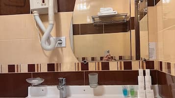 Hair dryer, slippers, towels, soap