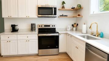 Coffee/tea maker, fridge, microwave, oven