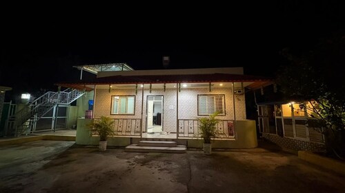 Cozy 1-bedroom farmhouse in serene Badlapur with AC