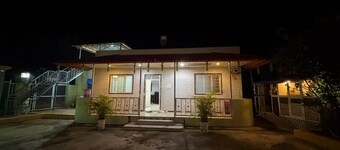 Cozy 1-bedroom farmhouse in serene Badlapur with AC