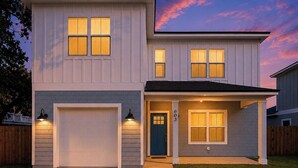 A two-story house with a garage, a front porch, and a number '603' on the door. - Private Pool • Walk to St. Augustine Beach (St. Augustine)