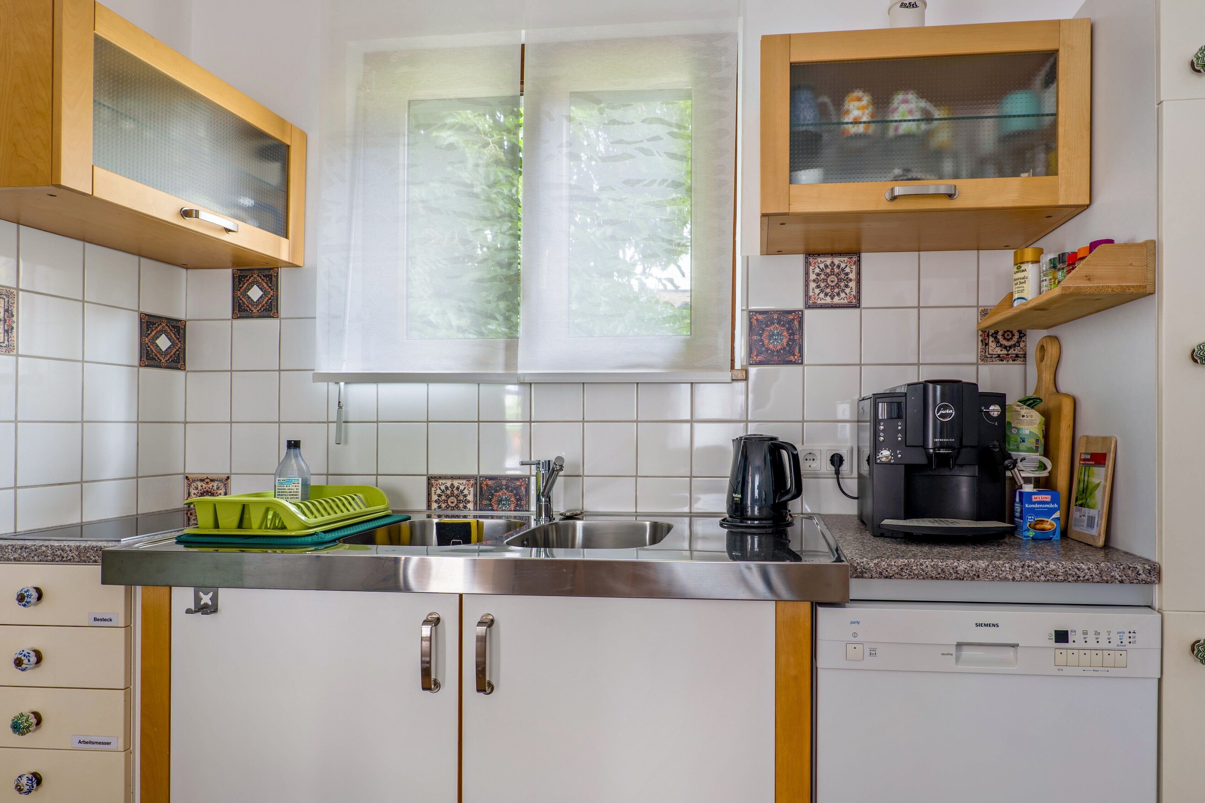 Coffee/tea maker, fridge, stovetop, dishwasher
