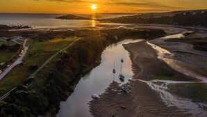 A river with boats, a road, and a sunset. - Abbotscot near Bantham, S. Devon (West Buckland, Bantham)