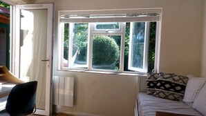 A room with a desk, chair, and a bed with patterned pillows. - Abbotscot near Bantham, S. Devon (West Buckland, Bantham)
