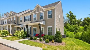 A multi-story residential building with a covered front porch and a landscaped front yard. - Stylish Antioch Stay Minutes to Downtown Nashville (Nashville)