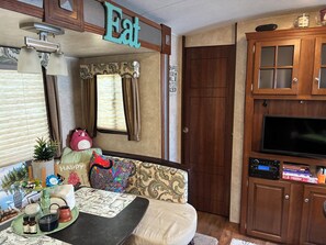 Smart TV, books - My Little RV Getaway in Pass Christian, Mississippi (Pass Christian, MS 39571)