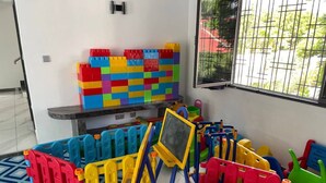 A play area with colorful building blocks, a chalkboard, and a small table. - A Luxurious 5-Bedroom Kids friendly Private Villa in the Heart of Watamu. (Kilifi)