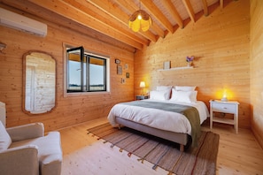 A cozy wooden room with a bed, bedside tables, a mirror, and a window. - Les Lodges d'Opale, 32 guests, 16 rooms (Vironchaux)