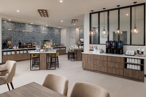 A modern kitchen with a central island, bar stools, and a breakfast bar. - Home2 Suites By Hilton Chattanooga West Lookout Mountain (Chattanooga)