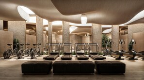 A modern fitness center with exercise bikes, treadmills, and elliptical machines. - Hilton Kuwait Mangaf Resort (Mangaf)