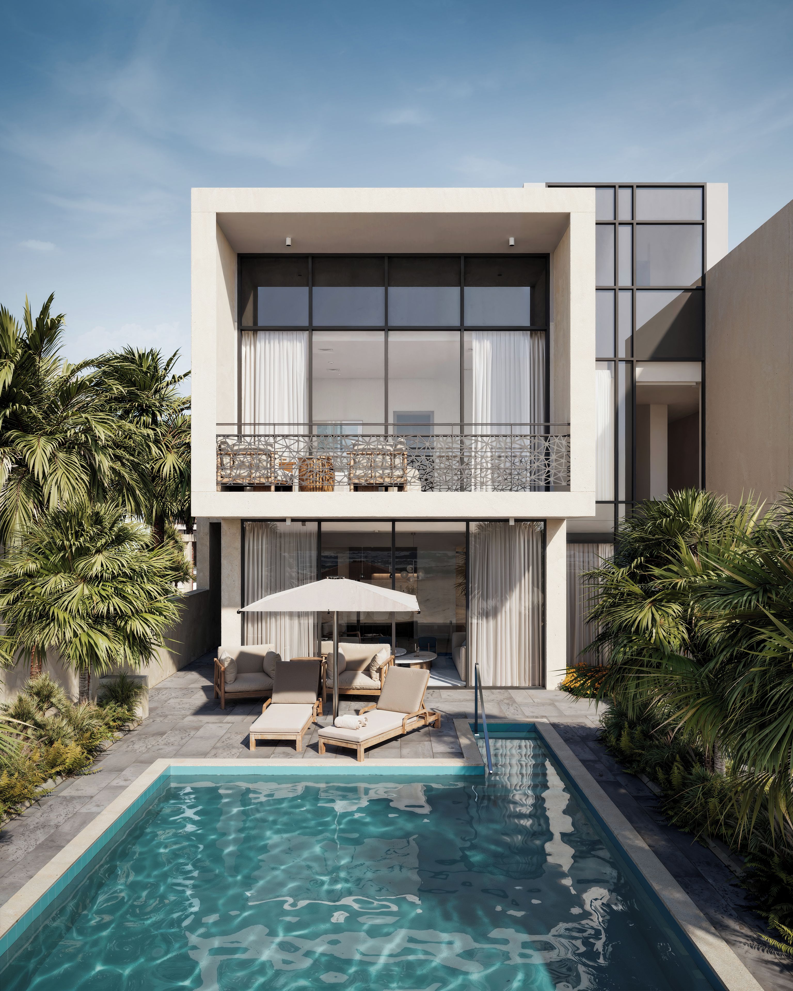 A modern two-story building with a swimming pool, outdoor seating, and tropical plants.