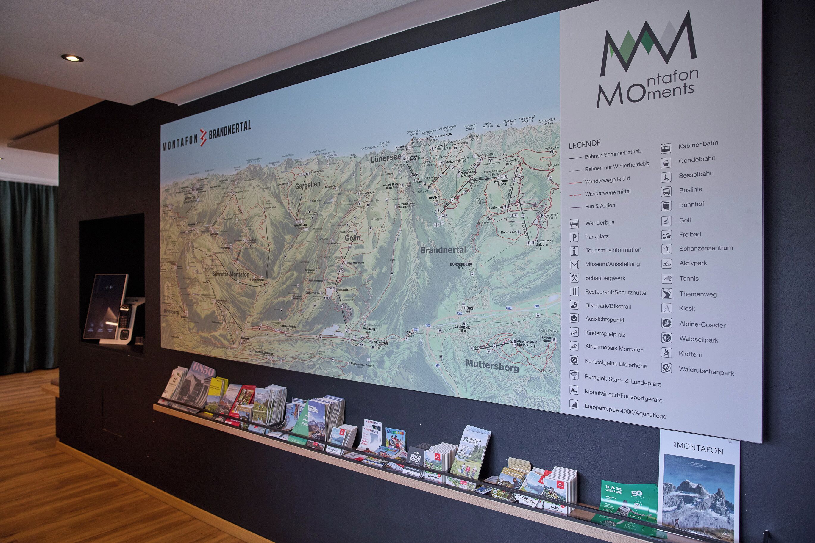 A large map with a legend on the right side, indicating various points of interest and facilities such as restaurants, ski resorts, and hiking trails.