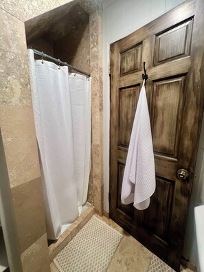 Shower, towels, toilet paper