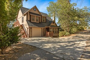 A two-story house with a garage, a front porch, and a driveway. - Steps 2 Summit - Walk to Slopes, Pool Table (Big Bear Lake)