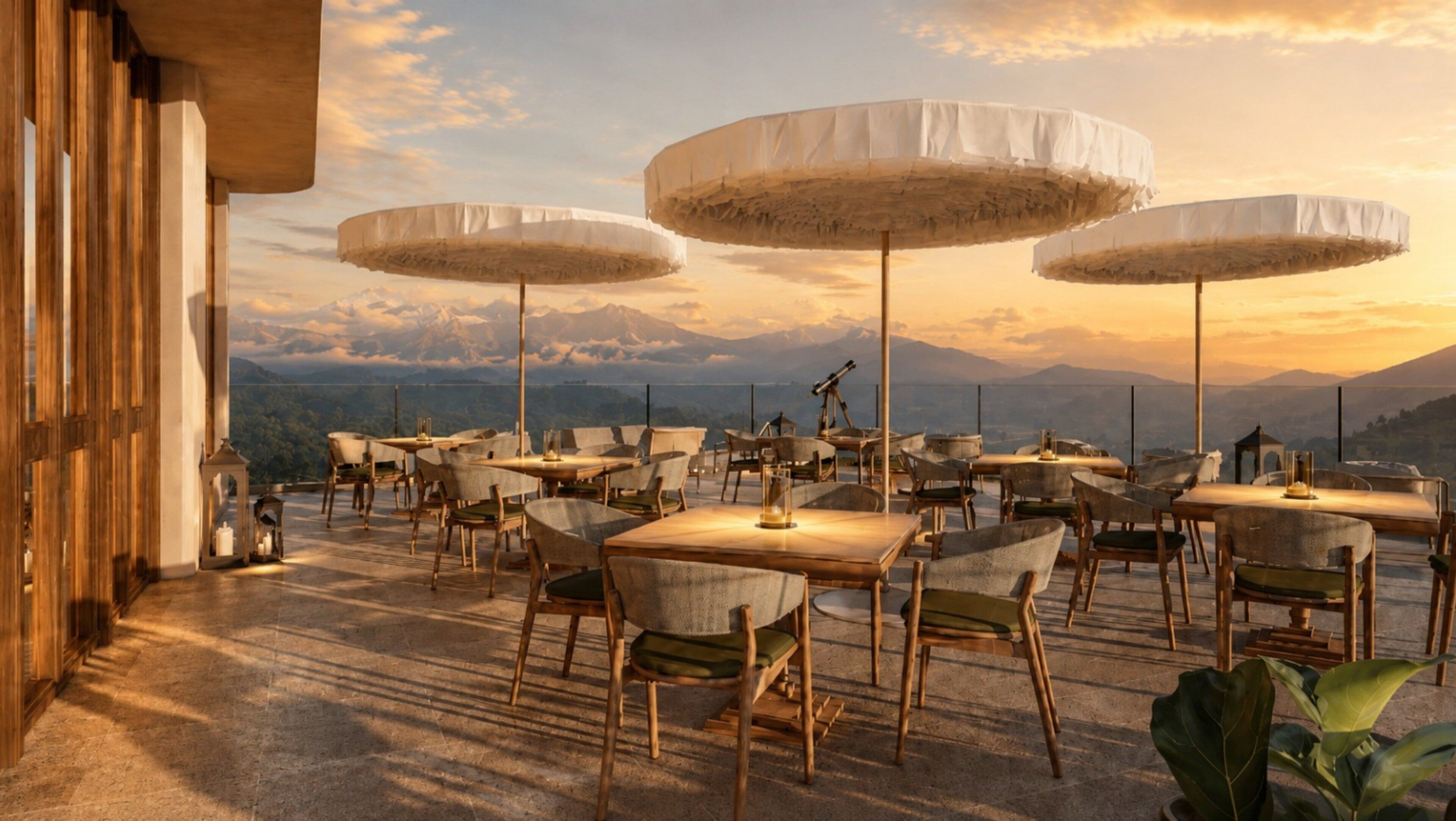 An outdoor dining area with tables and chairs, large umbrellas, and a mountain view.