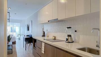 Fridge, microwave, stovetop, coffee/tea maker