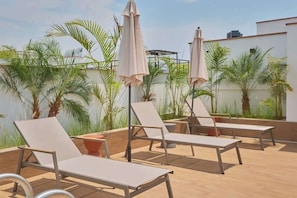Terrace/patio - Geko | Intimate 1BR Retreat in Miraflores w/ Pool (Miraflores)