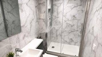 Shower, hair dryer, towels, soap