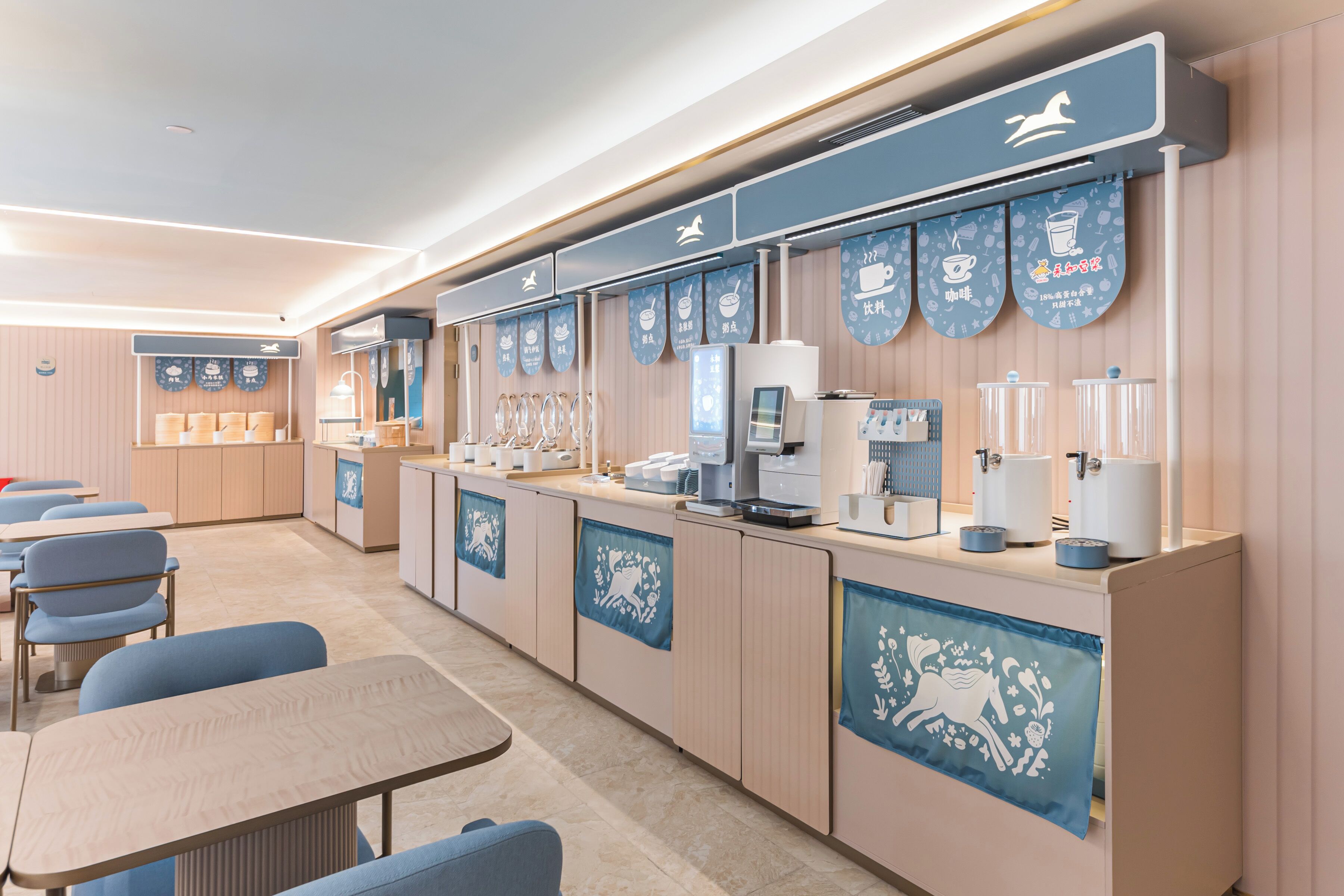 A modern cafe with seating, a coffee machine, and a menu board.