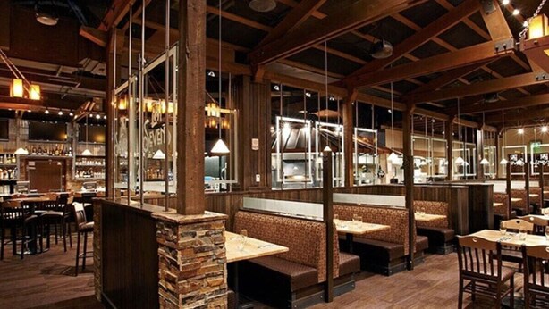 A restaurant with wooden beams, stone accents, and a bar area. - Luxury 2BR-Sleeps 8! Near Gondola and Hiking-Hot Tubs, Spa, A/C-June 2027 (Breckenridge)