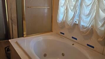Shower, towels, soap, toilet paper