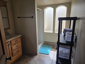 Shower, hair dryer, towels, soap