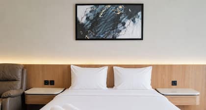 Restful Combined 2Br At Apartment Tamansari Skylounge Balikpapan