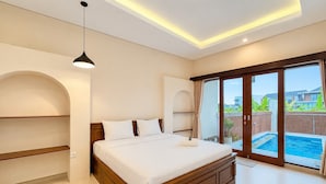A modern bedroom with a large bed, a ceiling light, and a view of a swimming pool. - 2BR Damar Pererenan Villa Near Canggu (Bali)