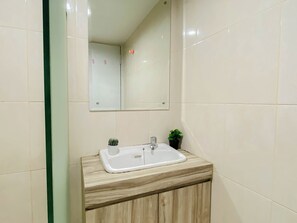 Standard Studio | Bathroom - Pleasant And Tidy Studio Room At Apartment Springlake Summarecon Bekasi (Bekasi)