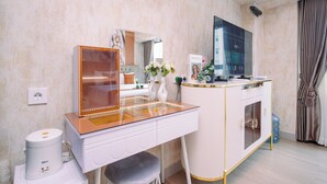A bathroom with a vanity, mirror, and a toilet. - Sophisticated Studio At Apartment Springlake Summarecon Bekasi (Bekasi)