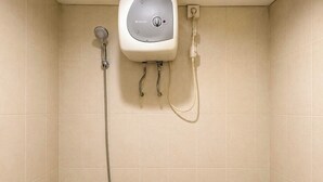 A shower with a control panel, a handheld showerhead, and a hose. - Good Deal Studio (No Kitchen) Apartment Skyland City Jatinangor (Sumedang)