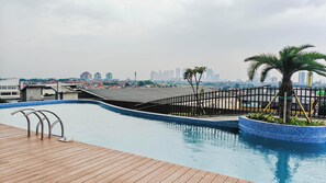Outdoor pool - Fully Furnished Studio Apartment At Westown View Surabaya (Surabaya)