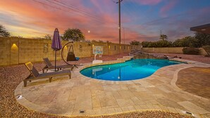A swimming pool with a basketball hoop, lounge chairs, and a sunset view. - Privat Pool w/ Diving Board, Arcade & BBQ, Prime N. Phoenix Location! (Phoenix)