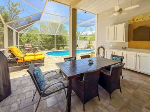 Outdoor dining - Triple Tales - Waterfront Property with Dock, Private pool & 2 minutes to beach! (Captiva)