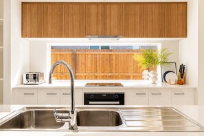 Private kitchen - Haus Verde | 4BR Greenbank Hideout in Logan (Greenbank)