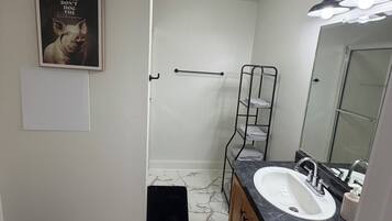 Shower, towels, soap, toilet paper