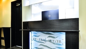 A reception area with a sign reading 'CENTRAL HOTEL' and a tiled floor. - ikebukuroCentralhotel (Tokyo)
