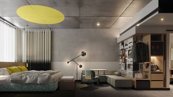 A modern bedroom with a bed, bedside table, lamp, and a wardrobe with clothes and shoes.