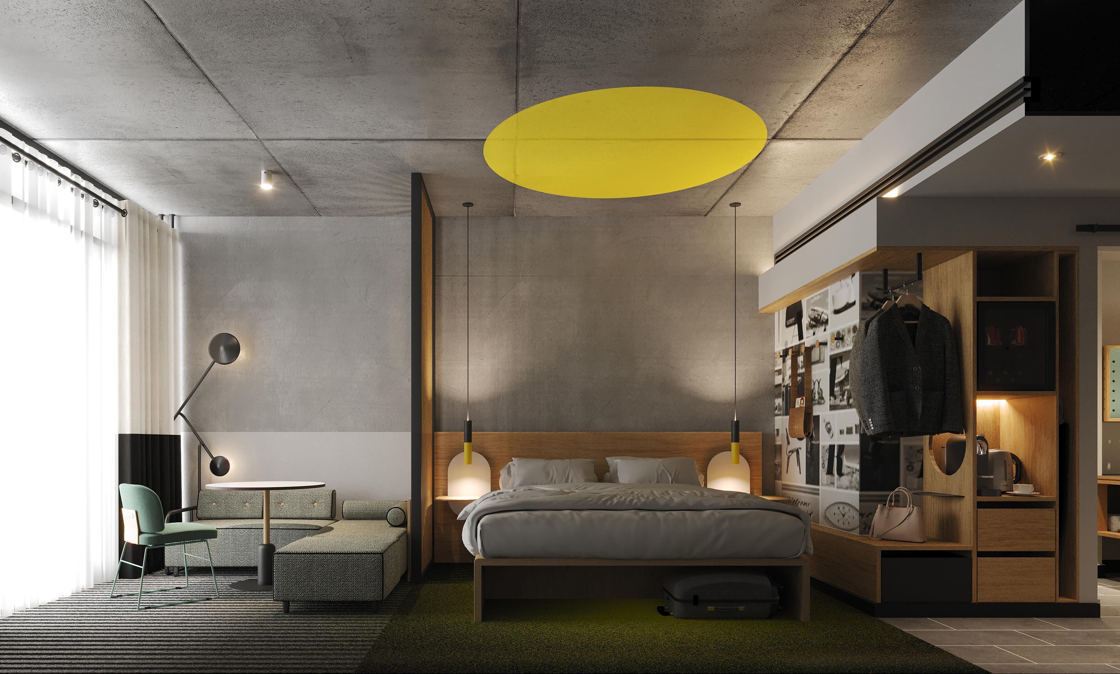 A modern bedroom with a bed, bedside tables, a wardrobe, and a seating area with a sofa and armchair.