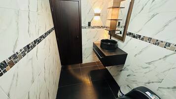 Shower, towels, soap, toilet paper