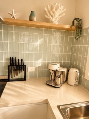 Coffee/tea maker, fridge, microwave, oven