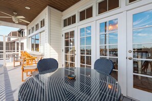 Outdoor dining - Private Pool + Dock + Bay Views | Walk to Beach + Times Square | Sunset Slip (Fort Myers Beach)