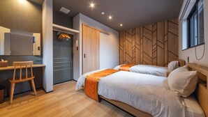 A modern bedroom with two beds, a desk, and a chair. - Activity Base Hida-takayama (Takayama)